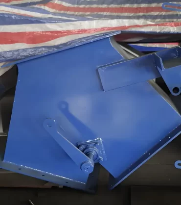 A blue diverter valve shows its structural and functional characteristics.