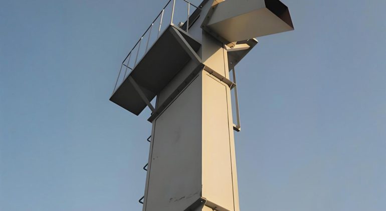 Darko NE Bucket Elevator - Efficient material handling solution designed for vertical lifting, featuring robust construction and high-capacity buckets for reliable performance in bulk material transport.